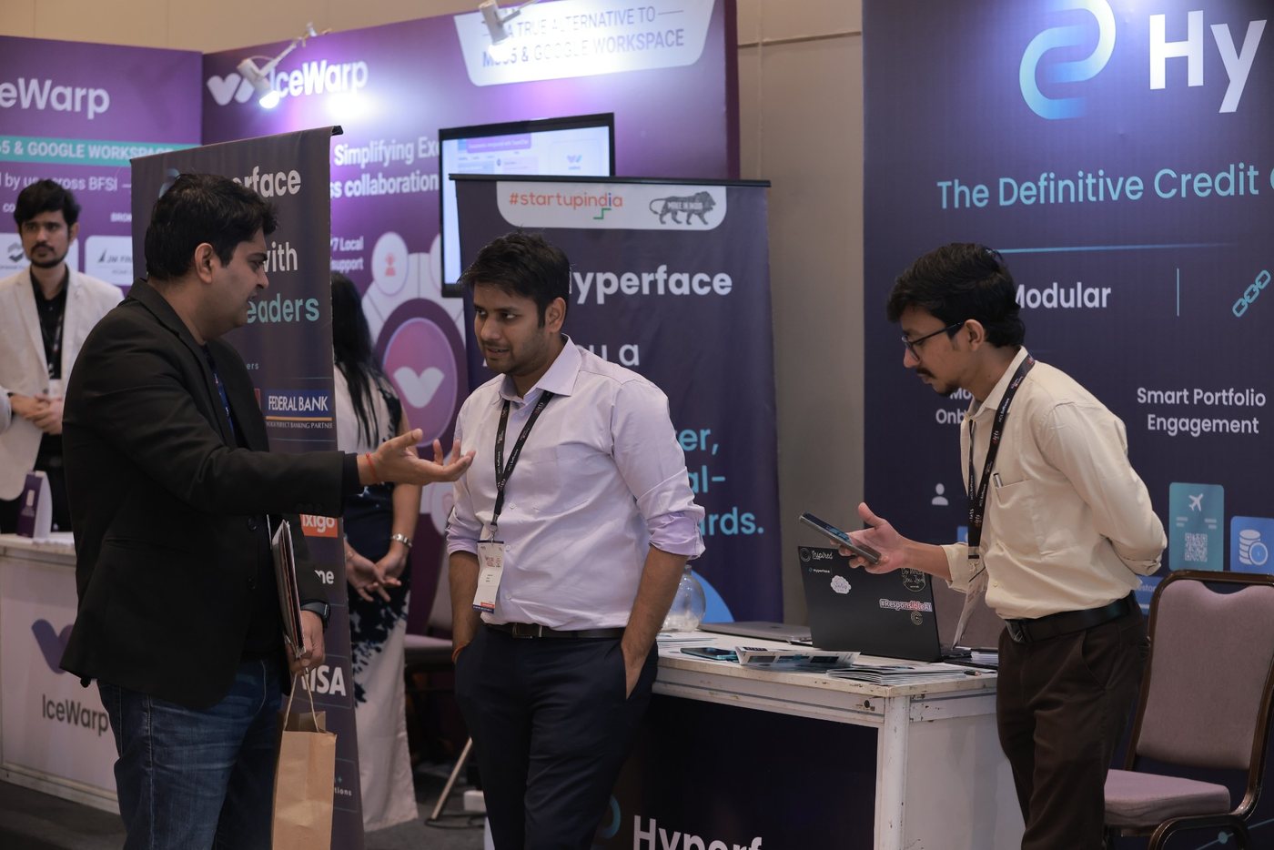 Delegates networking on the summit exhibition floor