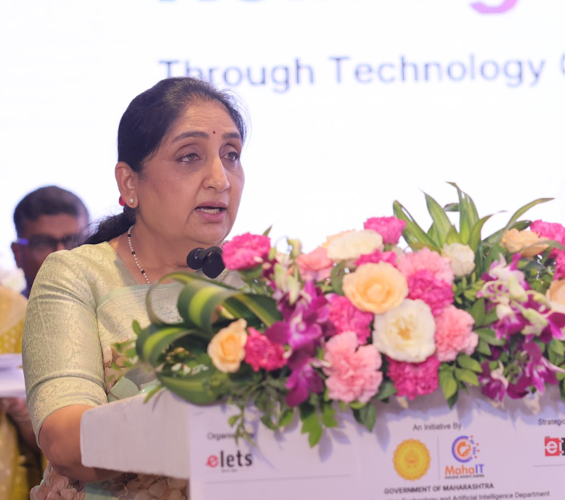 A senior government official delivering a keynote address from the podium at an Elets summit in Mumbai