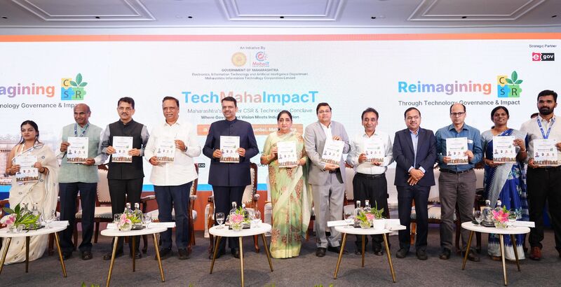 Dignitaries releasing a commemorative publication on stage at an Elets summit in Maharashtra
