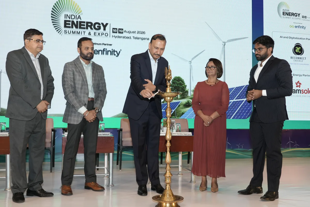 Dignitaries light the ceremonial lamp to open the India Energy Summit