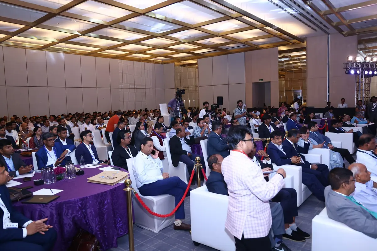 Delegates filling a conference hall during a session