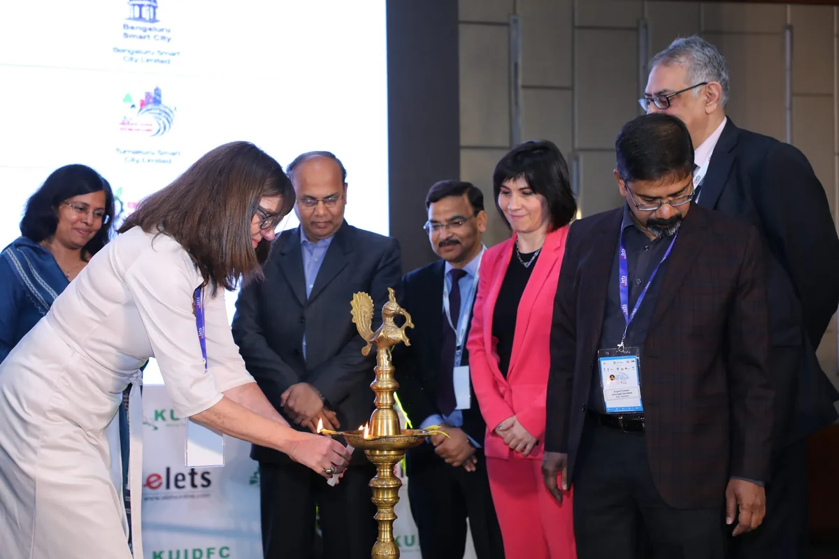 Dignitaries lighting the ceremonial brass lamp at the inauguration