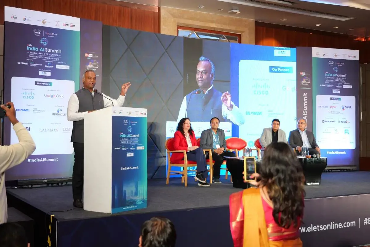 Keynote address delivered from the podium beside a seated panel