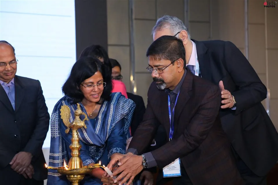 Guests lighting the ceremonial lamp at the opening