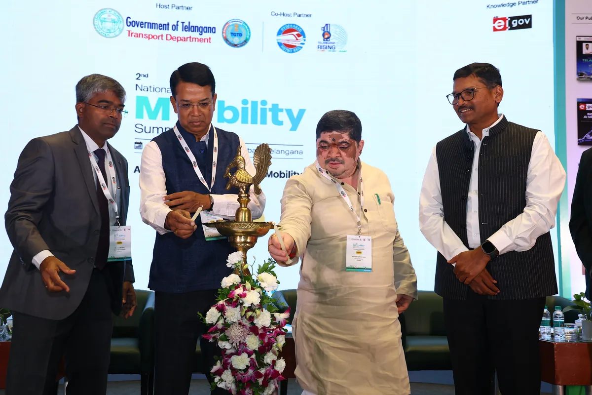 Dignitaries light the ceremonial lamp to open the National Mobility Summit