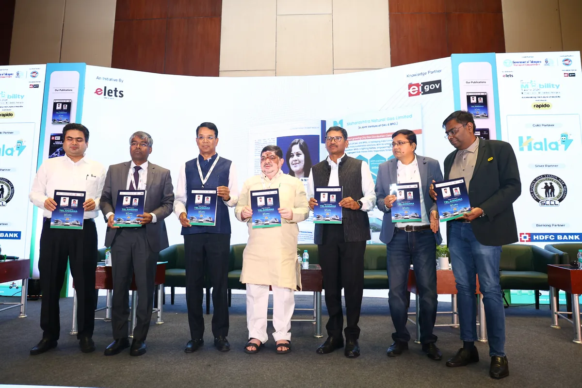 Dignitaries hold up a publication launched at the National Mobility Summit