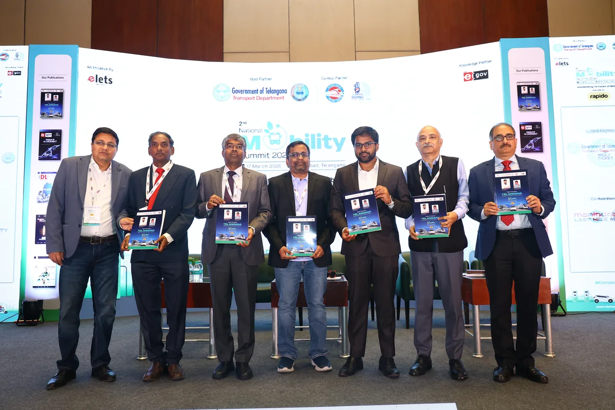Dignitaries with memento plaques on the National Mobility Summit stage