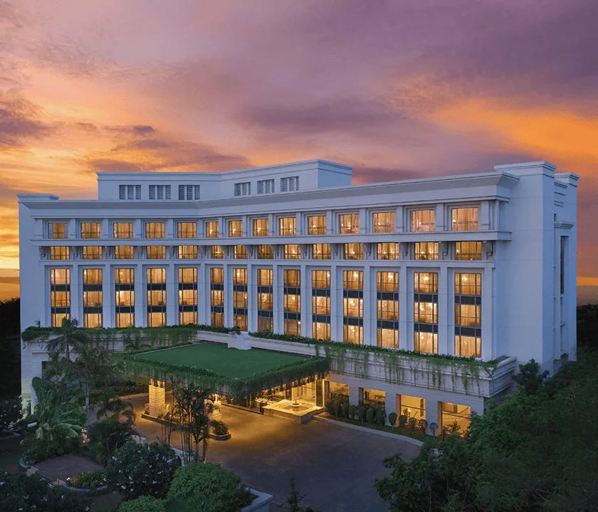 ITC Kakatiya, Hyderabad: the hotel's white facade lit up at dusk under an orange and violet sky